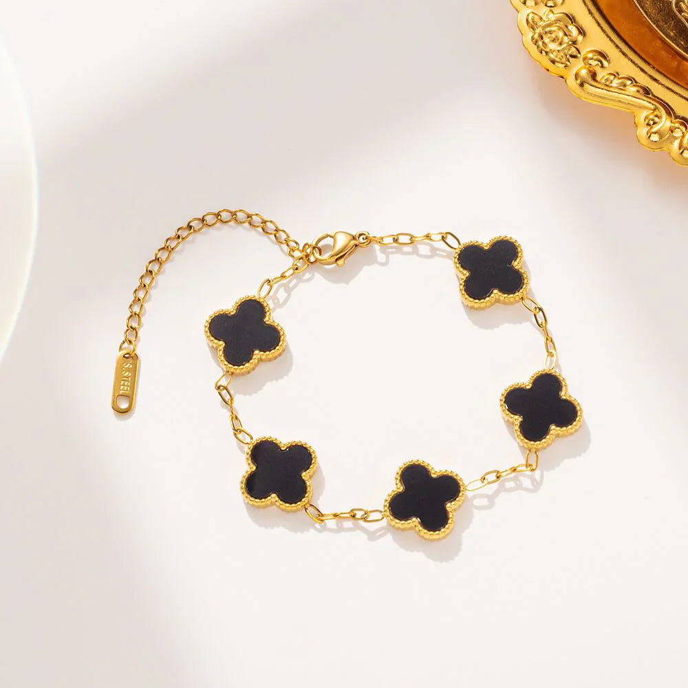 Elegant black four leaf clover charm bracelet featuring a minimalist adjustable band for women — view 2