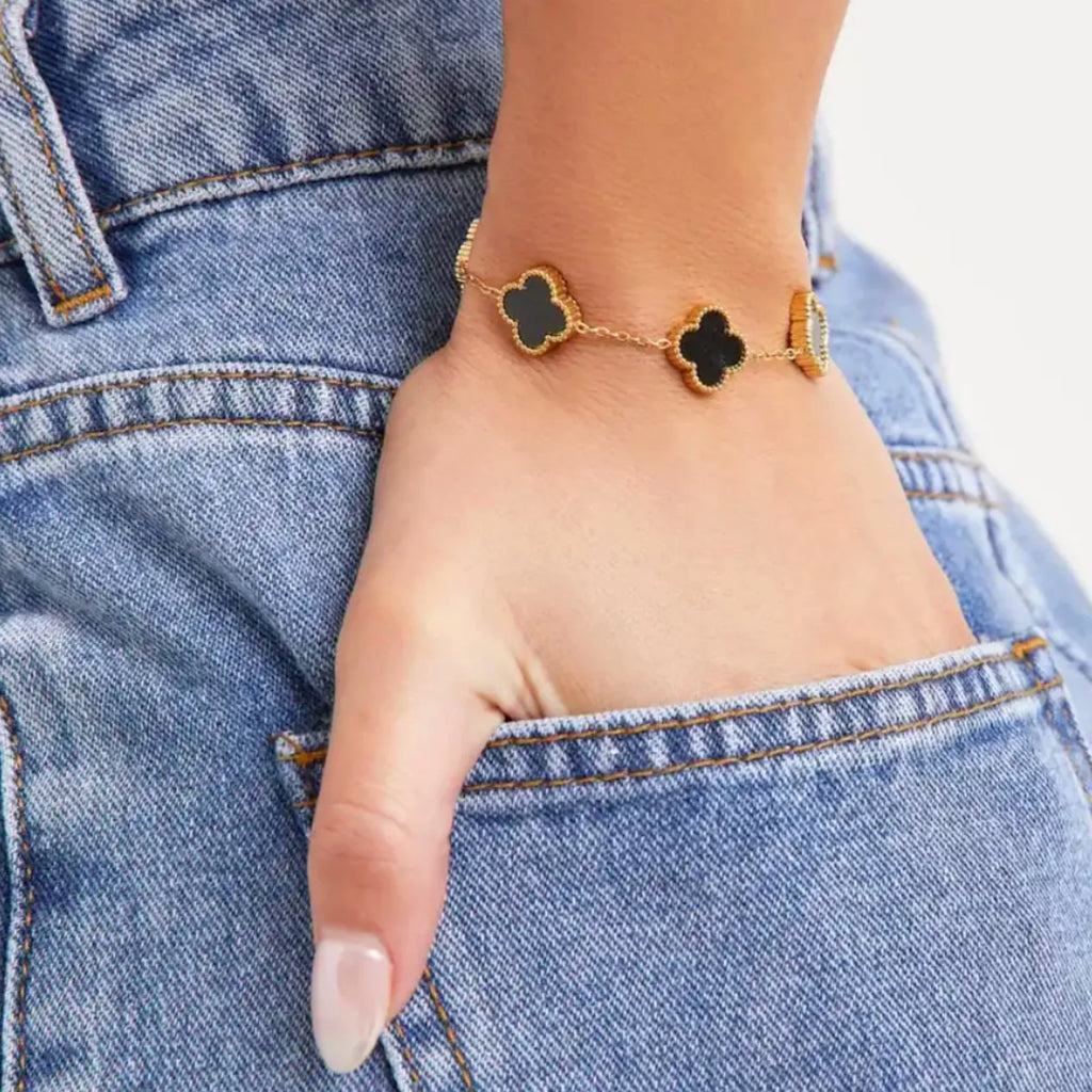 Elegant black four leaf clover charm bracelet featuring a minimalist adjustable band for women — view 3