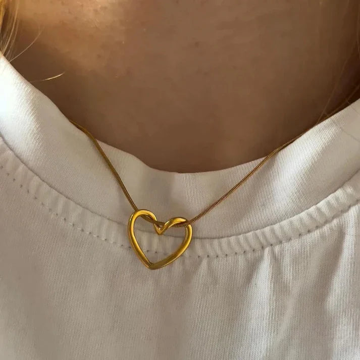 Heart pendant necklace in 18k gold plating with a delicate adjustable chain and polished finish — view 3