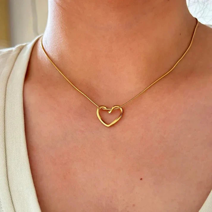 Heart pendant necklace in 18k gold plating with a delicate adjustable chain and polished finish — view 2