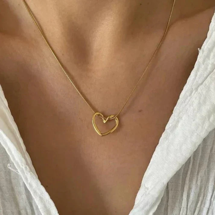 Heart pendant necklace in 18k gold plating with a delicate adjustable chain and polished finish — view 4