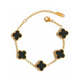 Elegant black four leaf clover charm bracelet featuring a minimalist adjustable band for women
