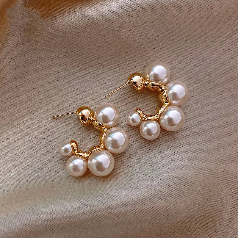 Elegant pearl cluster hoop earrings featuring a polished gold-plated finish and secure clasp design — view 4