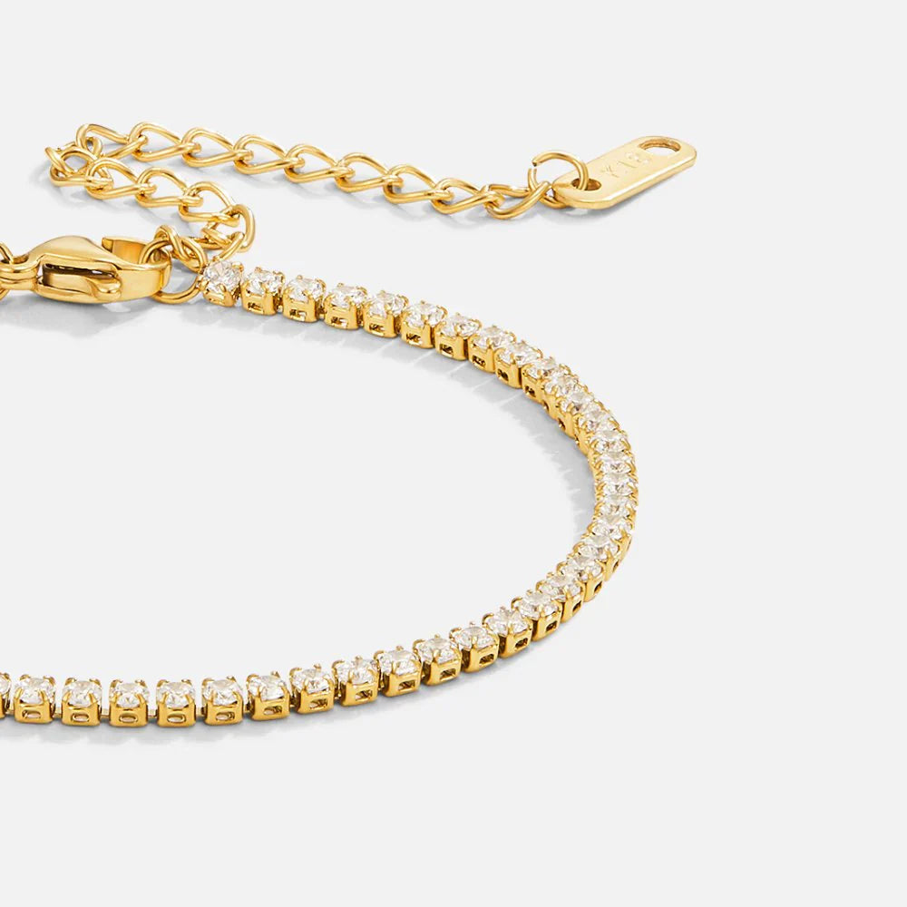 Elegant tennis bracelet with sparkling crystals set in a high-quality gold or silver-tone band. — view 2