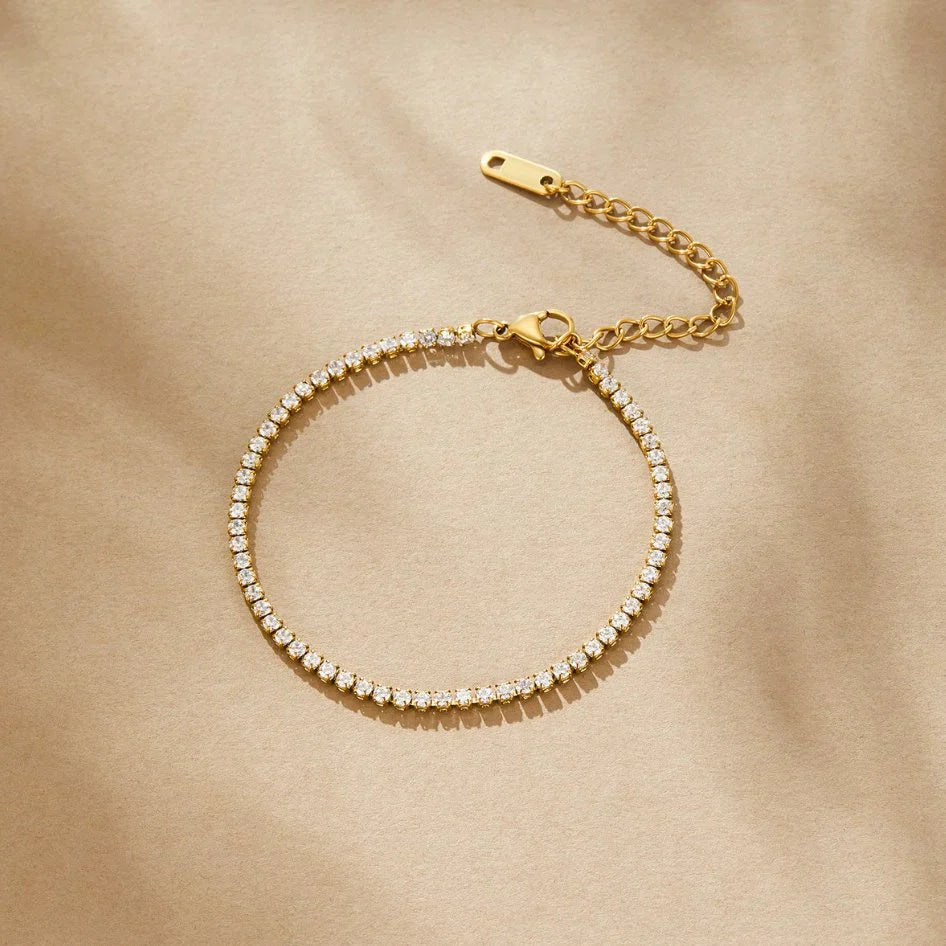 Elegant tennis bracelet with sparkling crystals set in a high-quality gold or silver-tone band. — view 3