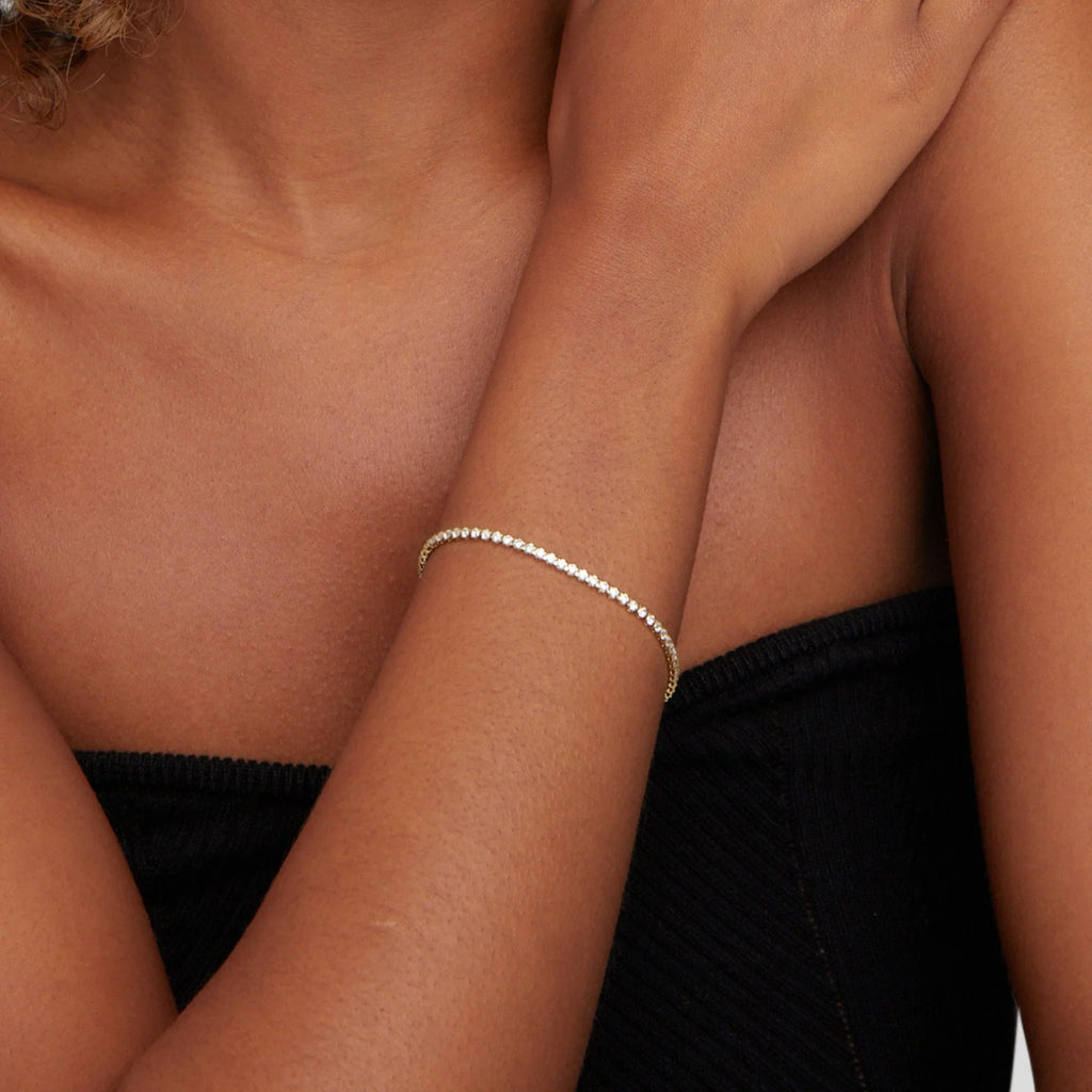 Elegant tennis bracelet with sparkling crystals set in a high-quality gold or silver-tone band. — view 5