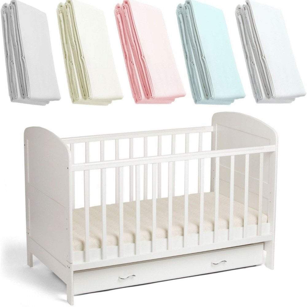 Soft white 100% cotton spacesaver cot fitted sheet with elasticized hem, covering a toddler mattress.