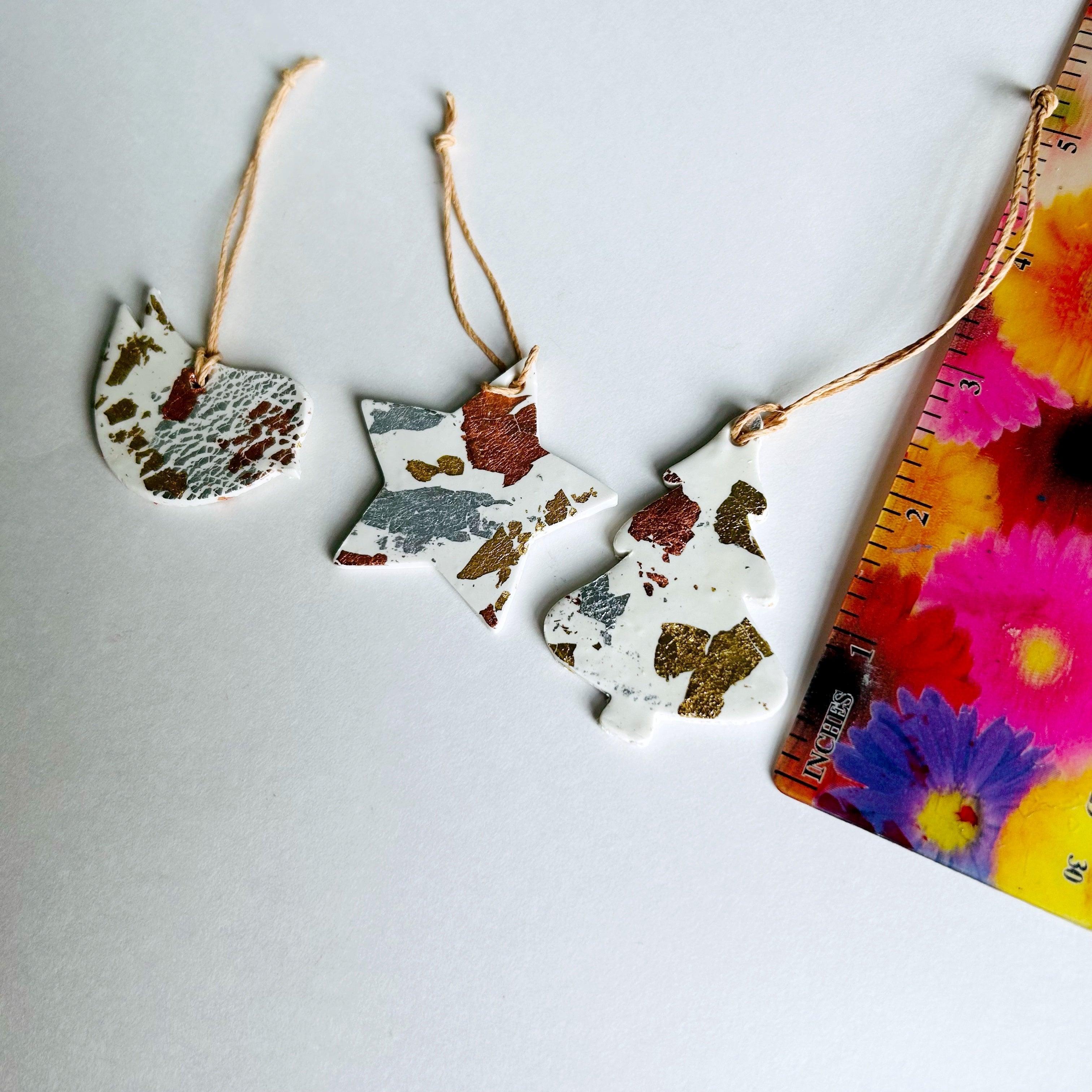 Set of three white polymer clay Christmas ornaments with gold silver and copper foil flakes. — view 5