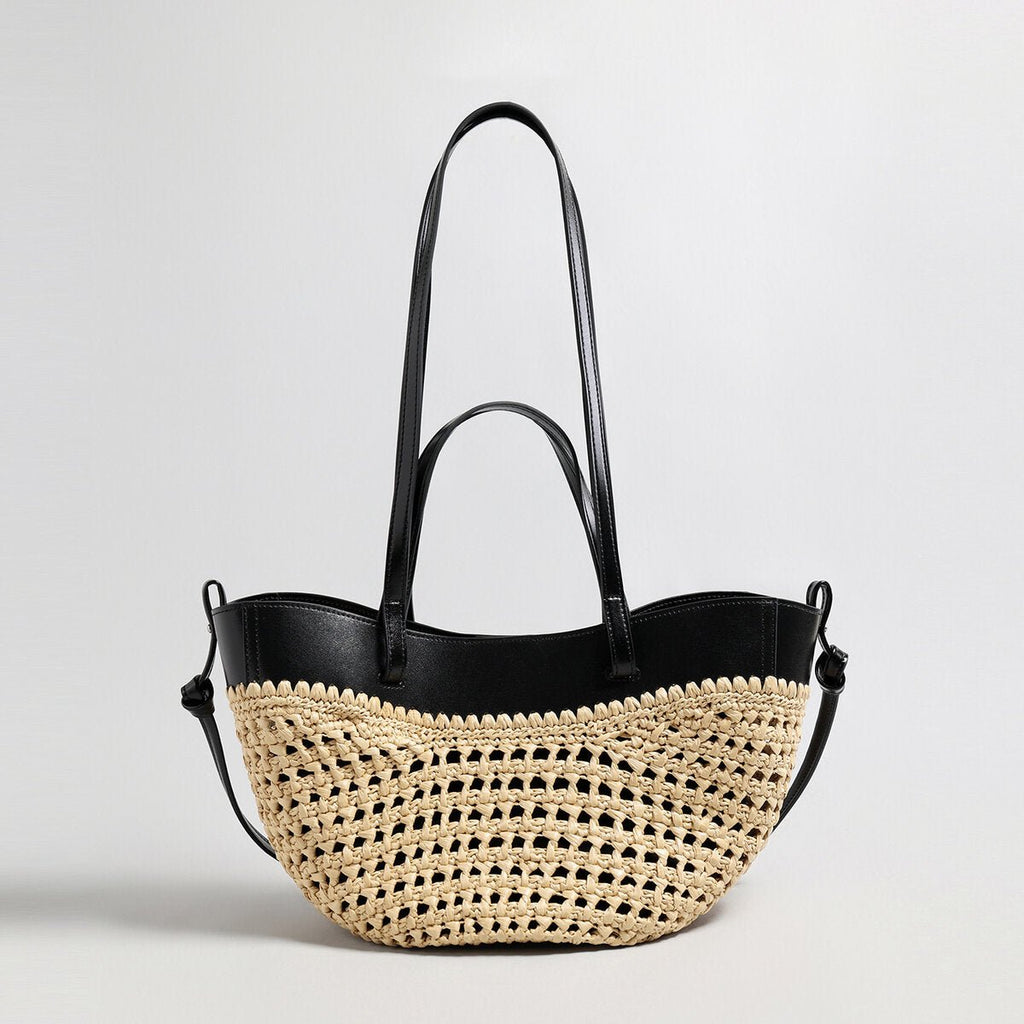 Handwoven natural straw and leather tote bag with multi-pocket interior and dual shoulder handles