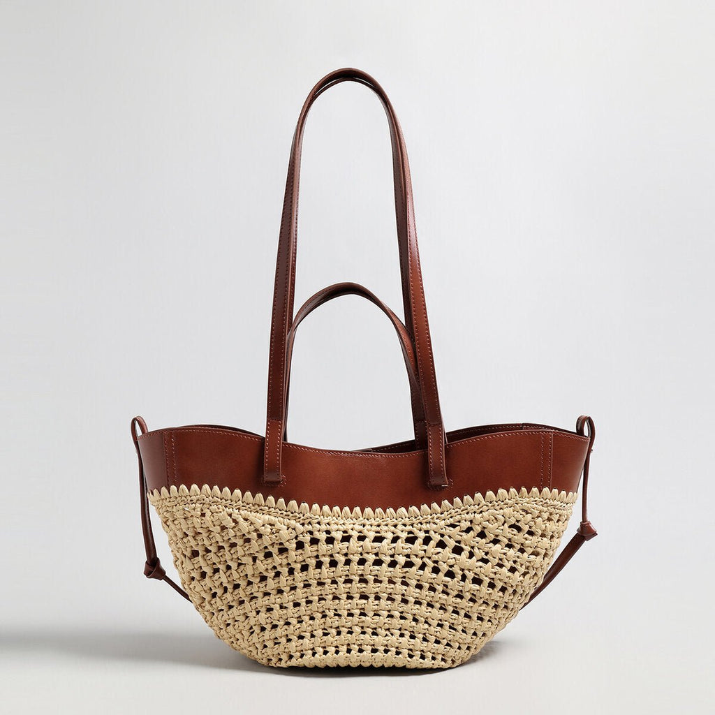 Handwoven natural straw and leather tote bag with multi-pocket interior and dual shoulder handles — view 2