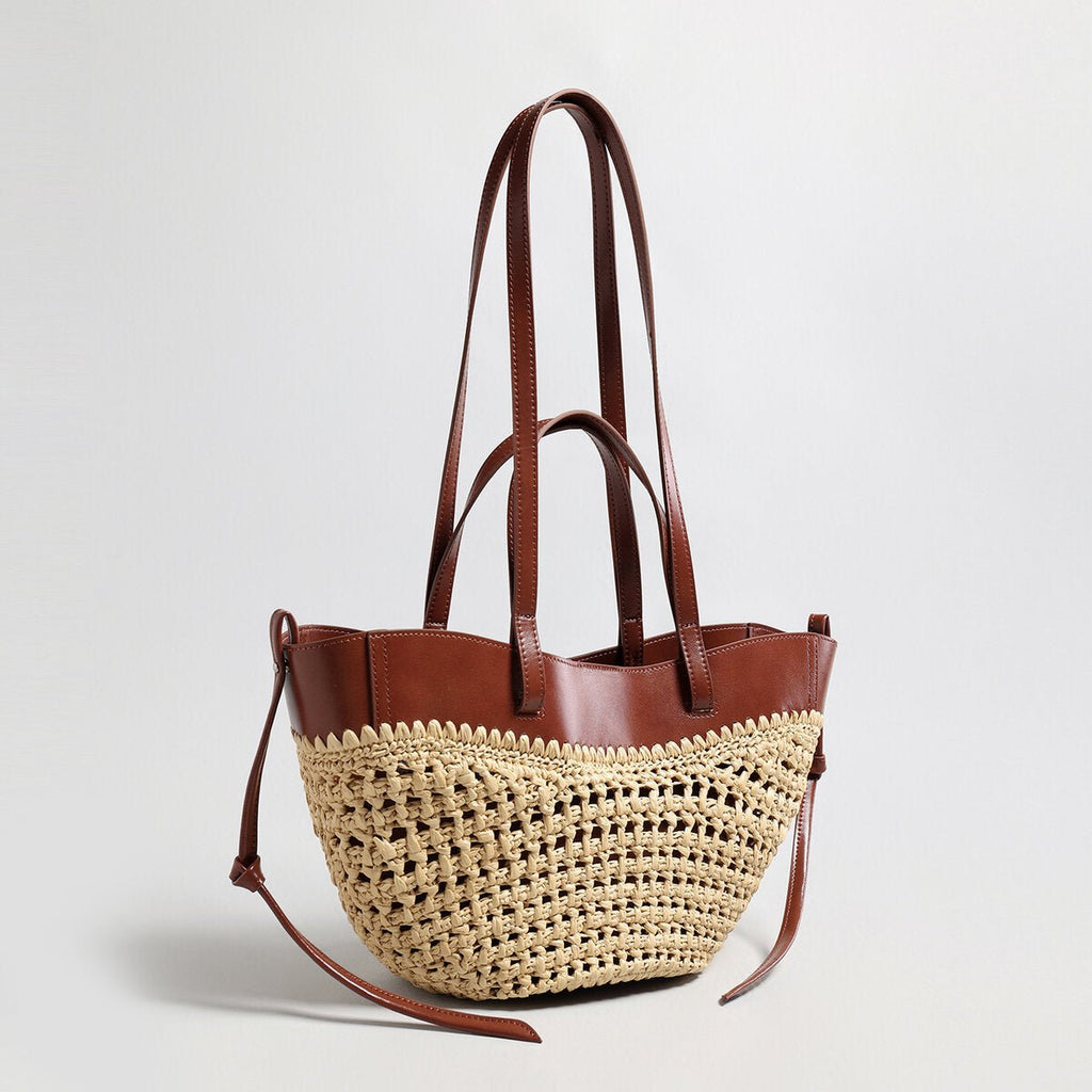 Handwoven natural straw and leather tote bag with multi-pocket interior and dual shoulder handles — view 3