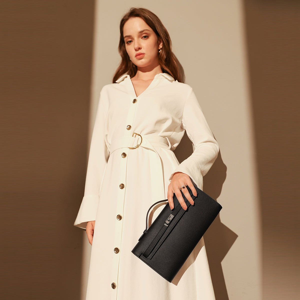 Structured saffiano leather top-handle clutch bag in elongated rectangular shape with silver turn-lock closure — view 2