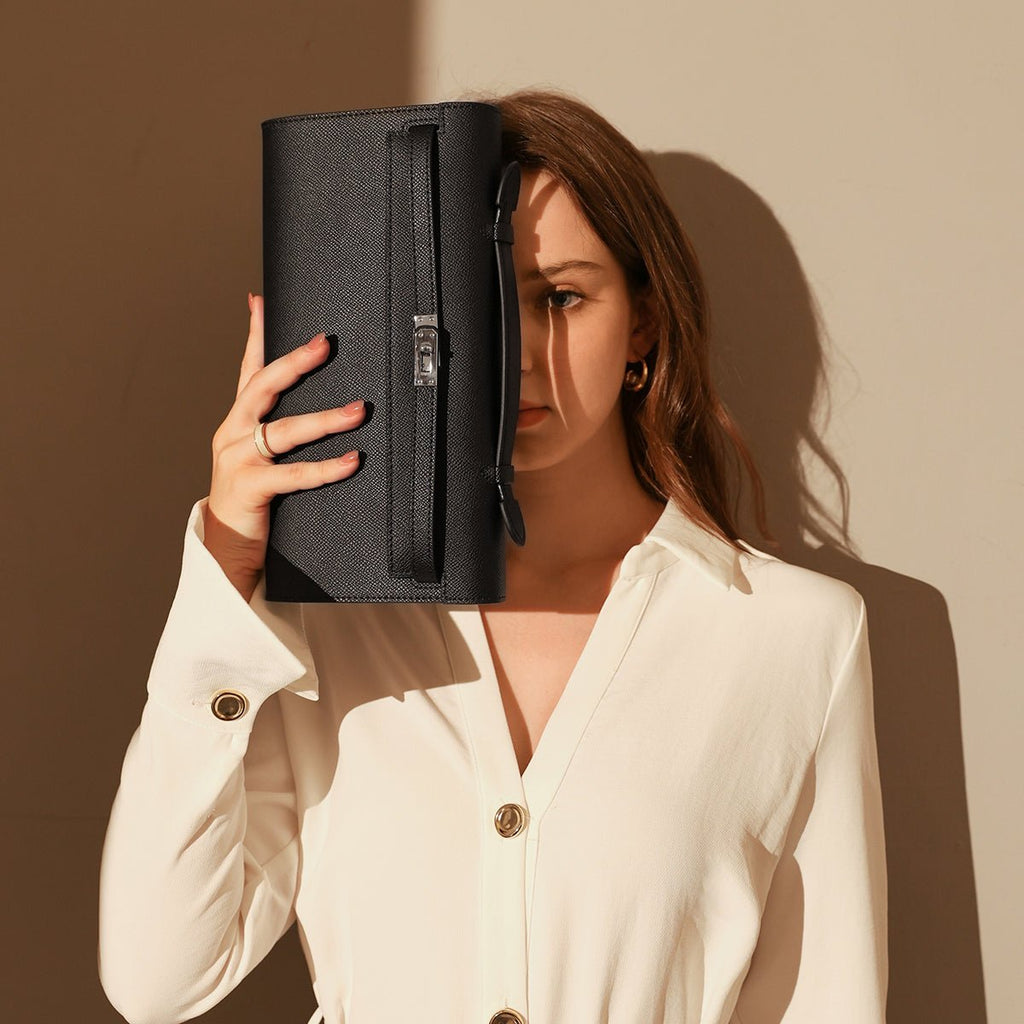 Structured saffiano leather top-handle clutch bag in elongated rectangular shape with silver turn-lock closure — view 3