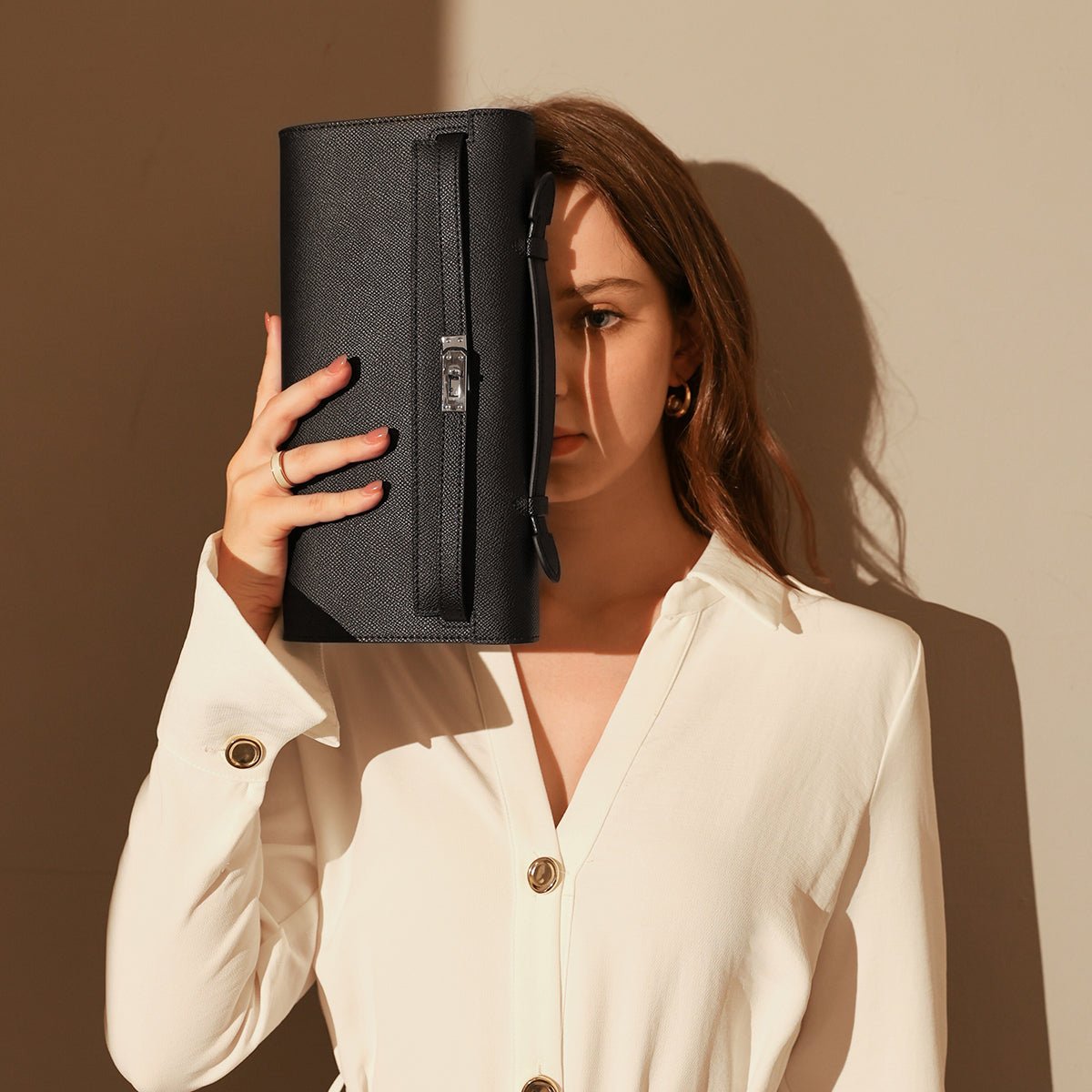 Structured saffiano leather top-handle clutch bag in elongated rectangular shape with silver turn-lock closure — view 3