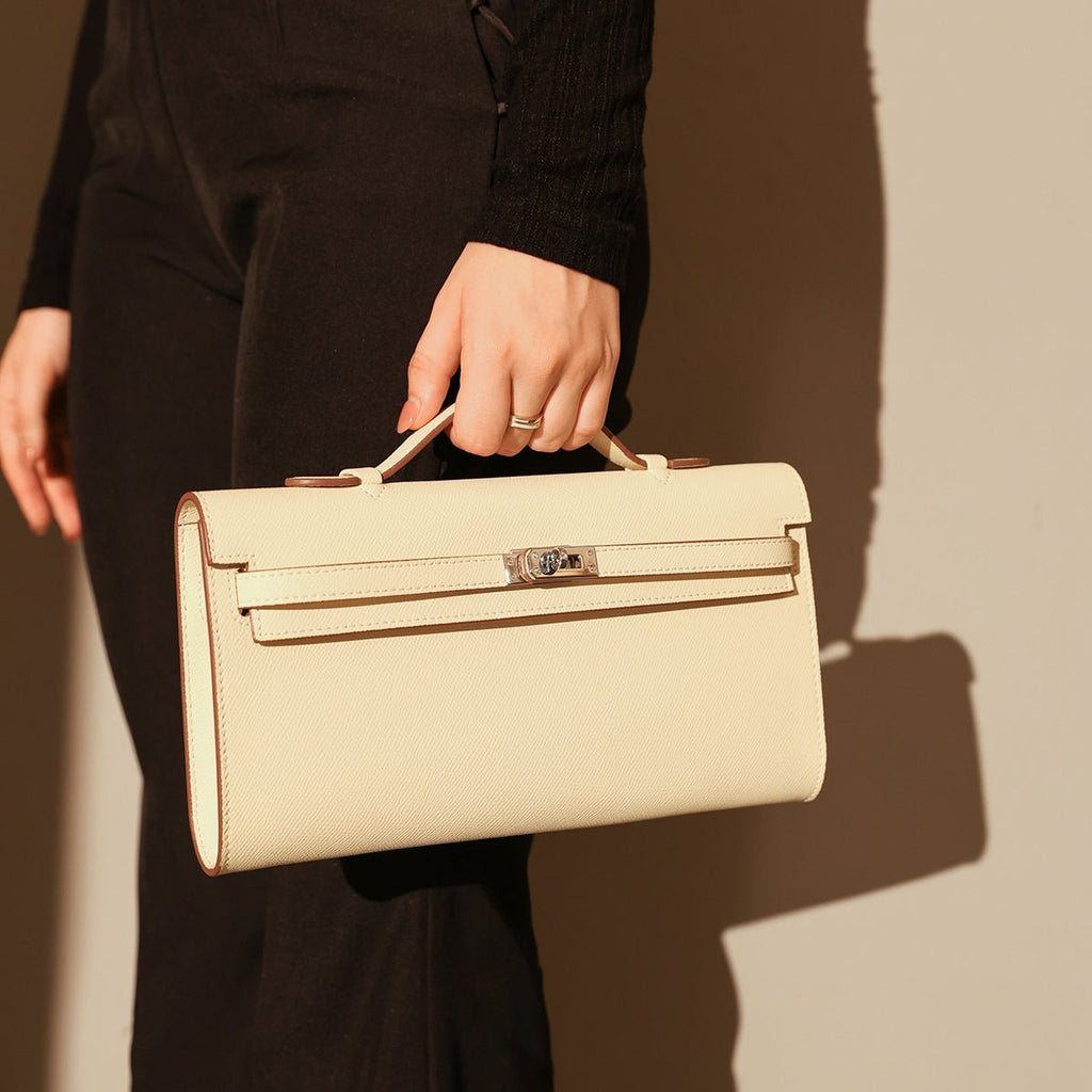 Structured saffiano leather top-handle clutch bag in elongated rectangular shape with silver turn-lock closure — view 4