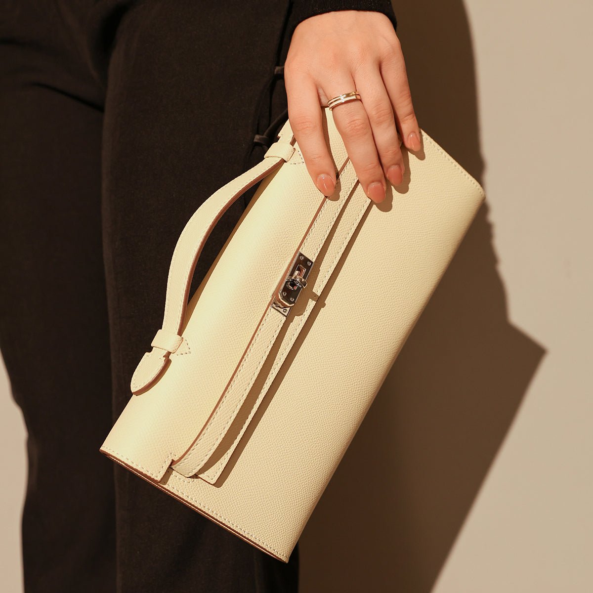 Structured saffiano leather top-handle clutch bag in elongated rectangular shape with silver turn-lock closure — view 5