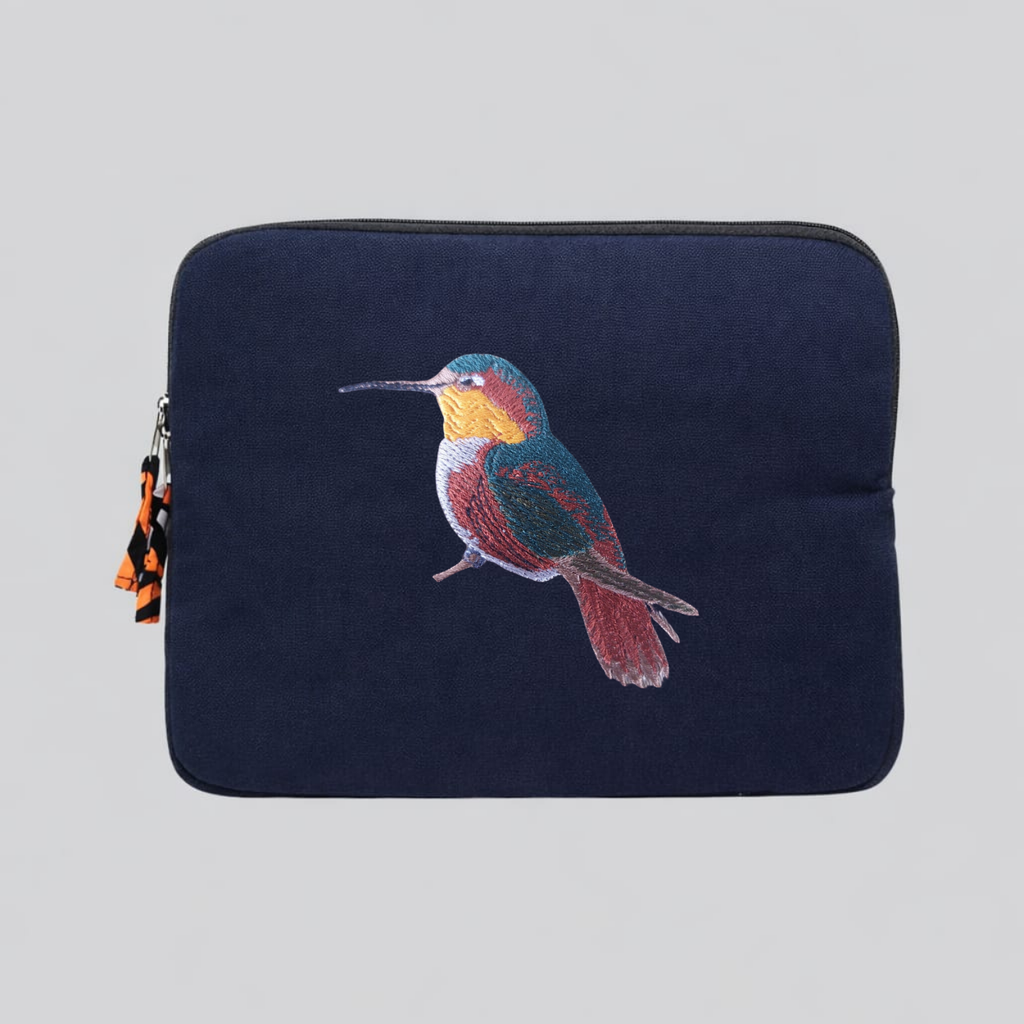 Handmade cotton canvas 13 inch laptop sleeve featuring detailed hummingbird embroidery in warm earthy tones