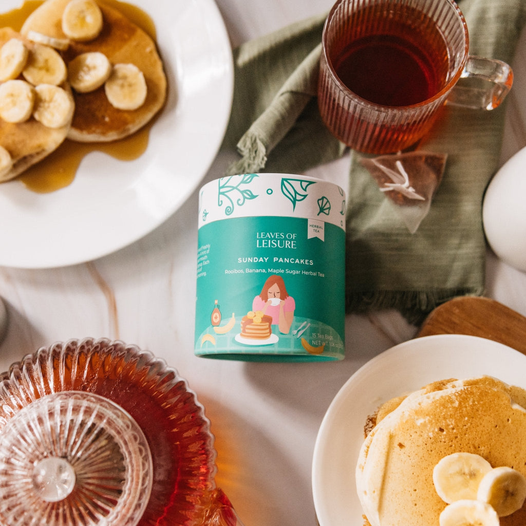 Sunday Pancakes herbal tea in a reusable paper canister alongside compostable corn mesh tea bags — view 2