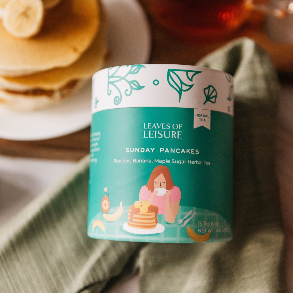 Sunday Pancakes herbal tea in a reusable paper canister alongside compostable corn mesh tea bags — view 4