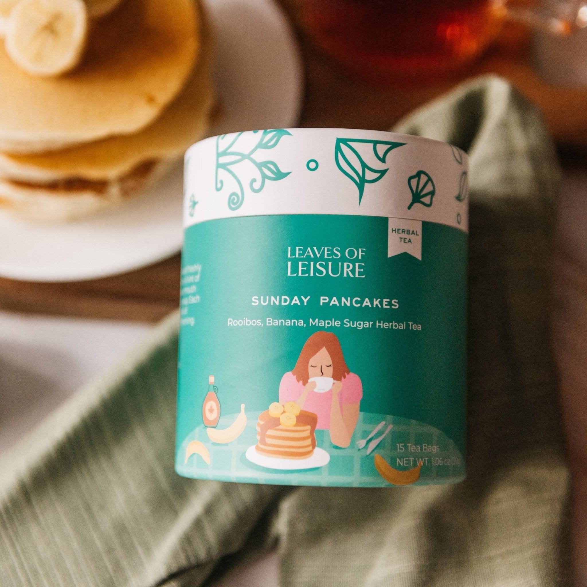 Sunday Pancakes herbal tea in a reusable paper canister alongside compostable corn mesh tea bags — view 4