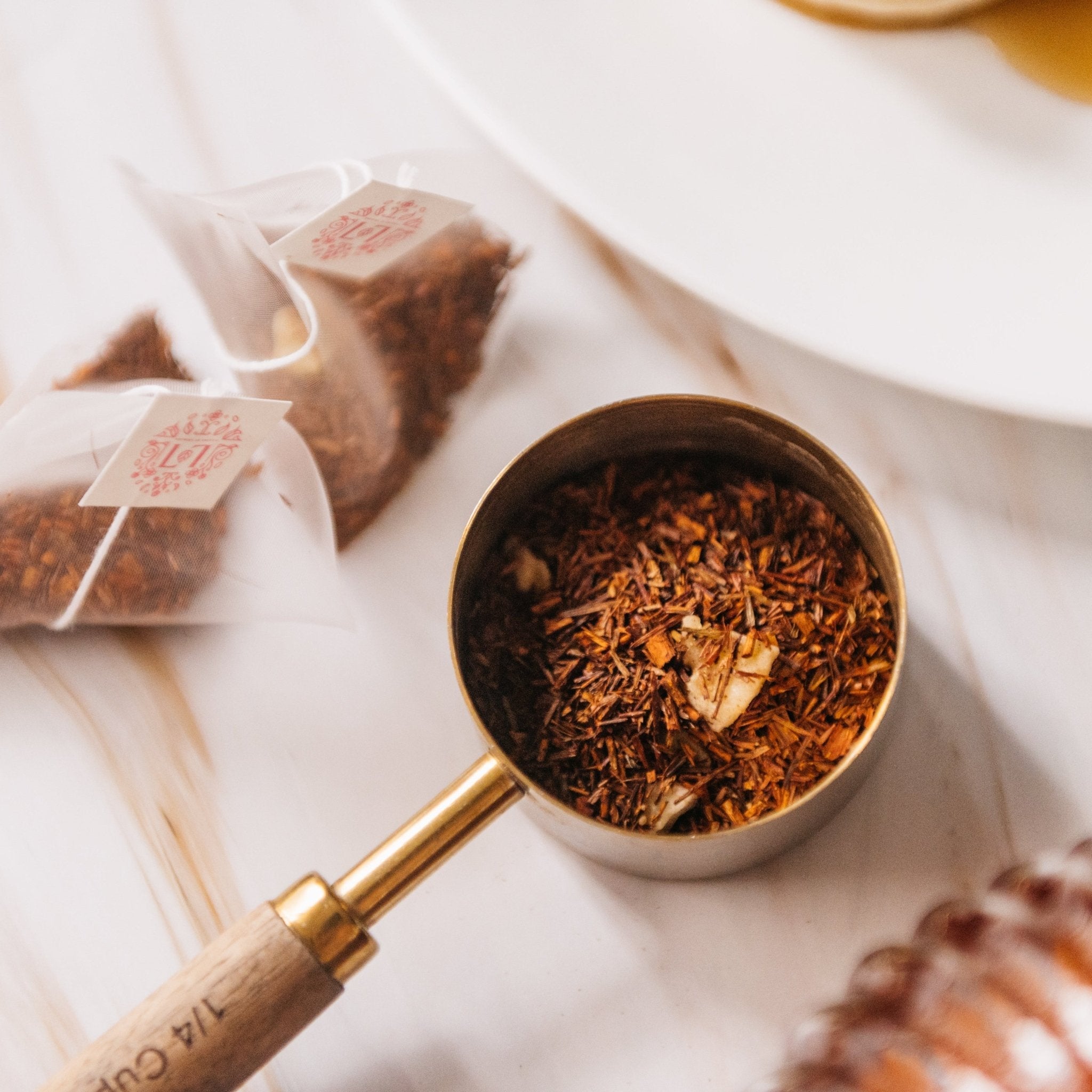 Sunday Pancakes herbal tea in a reusable paper canister alongside compostable corn mesh tea bags — view 5