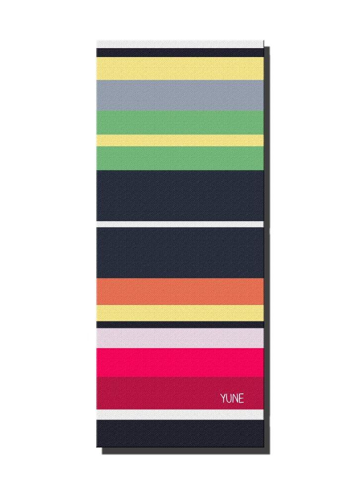 Houston yoga mat featuring a dark blue Space-City starry design unrolled on a studio floor
