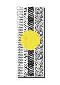 Jagger Yoga Mat with bold graphic print, unrolled flat on a studio floor