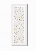 Crisp white Juno yoga mat rolled up, showing 6mm thick eco-friendly non-slip PER texture.