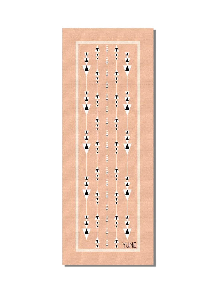 Tan eco-friendly 6mm non-slip yoga mat unrolled on the floor for fitness and pilates practice