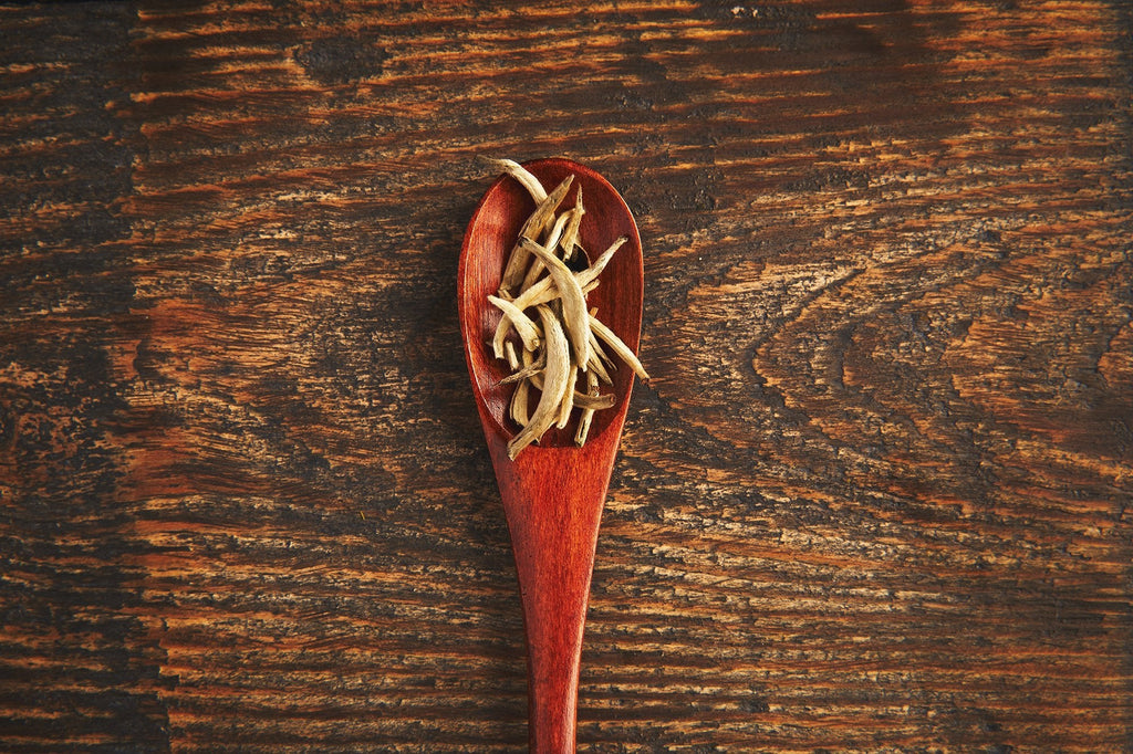 Nanmu wooden tea measuring spoon for precise loose leaf dosing featuring a smooth ergonomic handle — view 3
