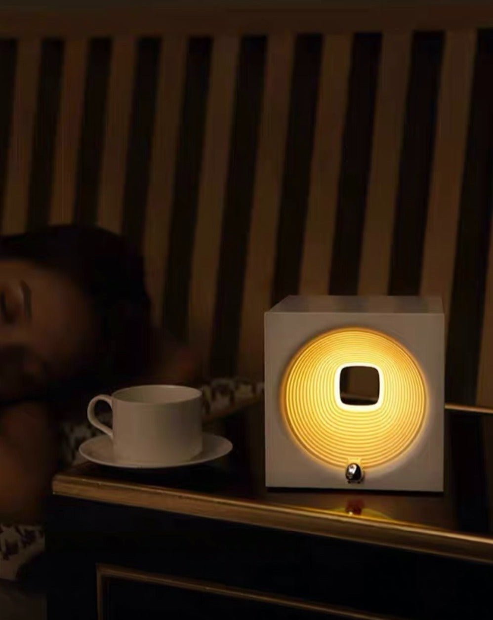 Time Machine bedside lamp with modern dimmable sleep light and built in speaker on nightstand