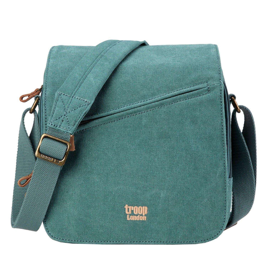 Stonewashed canvas flap crossbody bag with genuine leather trimmings and adjustable padded shoulder strap.