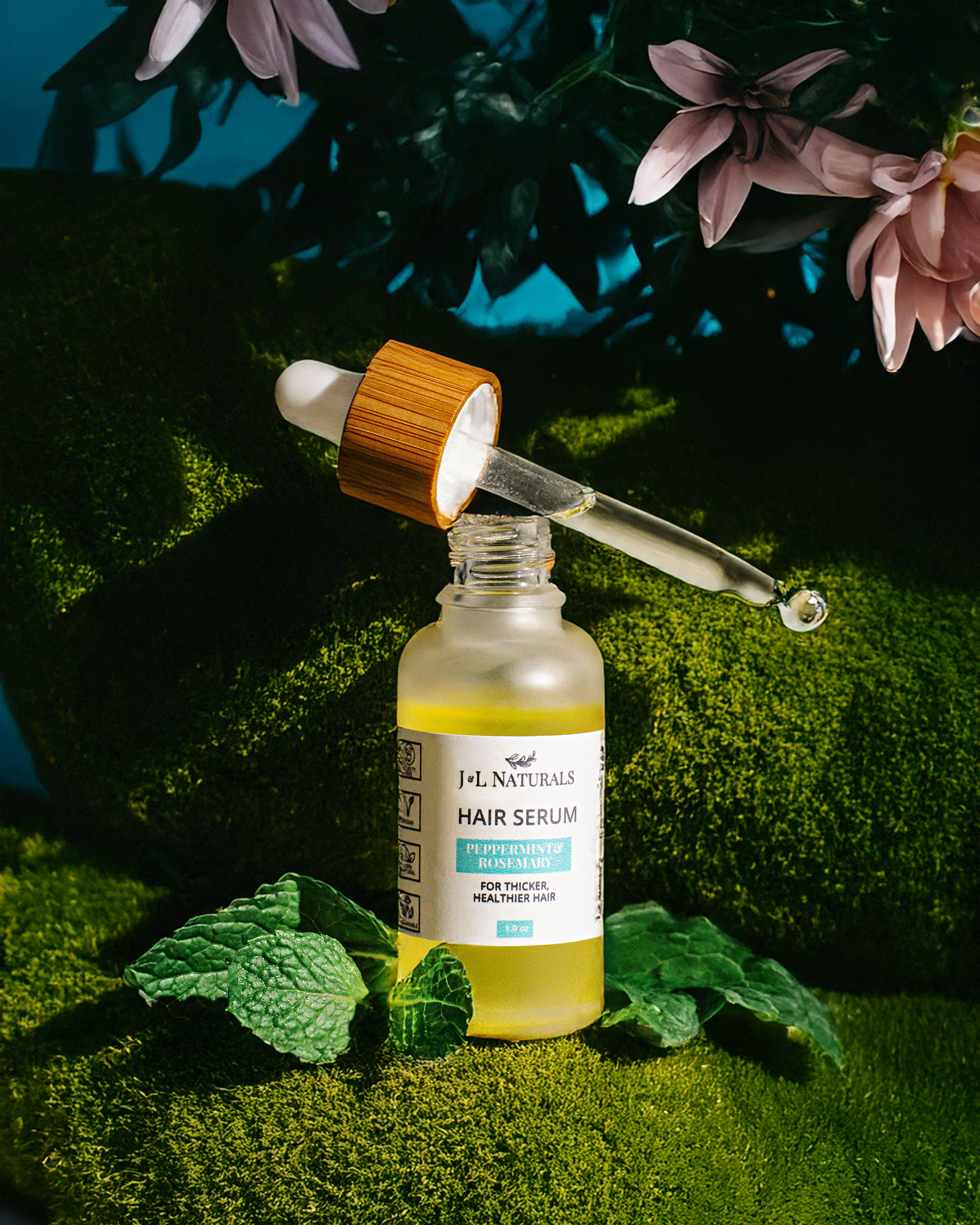 Vegan hair serum in a one ounce glass dropper bottle with natural botanical oils