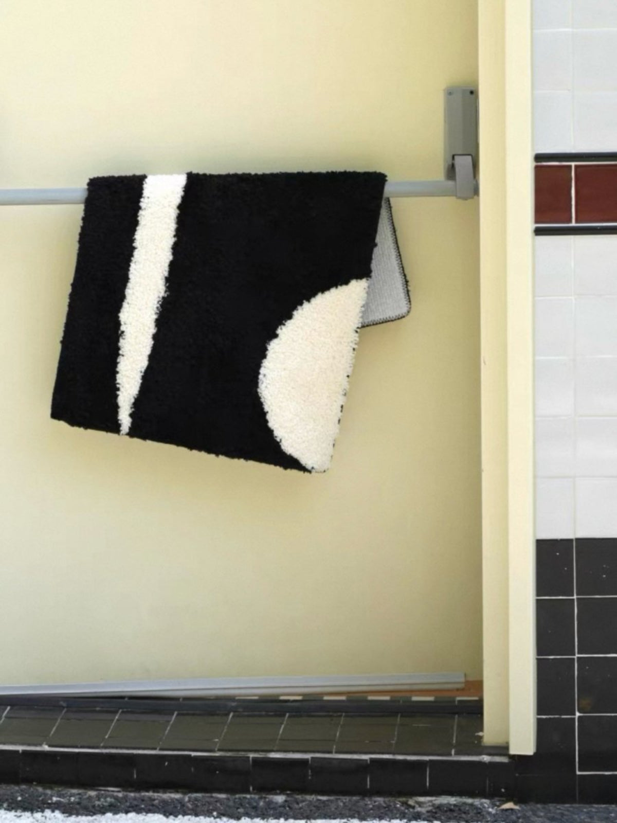 Ultra soft contemporary abstract bath rug in earthy tones with anti-slip backing on a bathroom floor — view 5