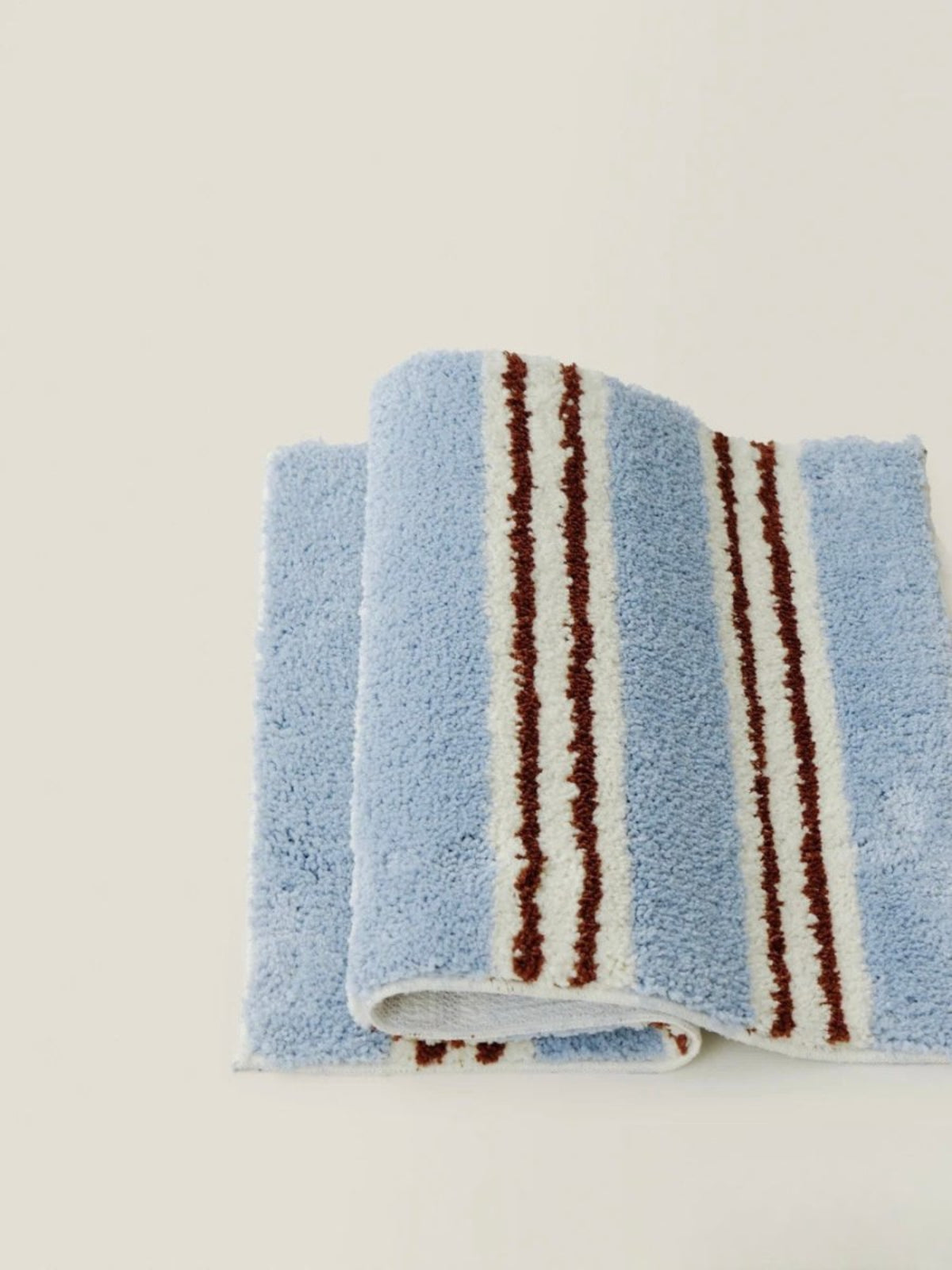 Retro blue stripe bath rug on floor, ultra soft and highly absorbent fluffy bathroom mat — view 3