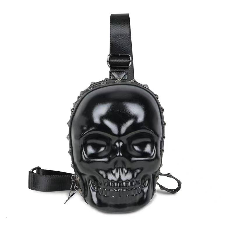 3D skull sling backpack in black PU leather with adjustable crossbody strap and zipper detail