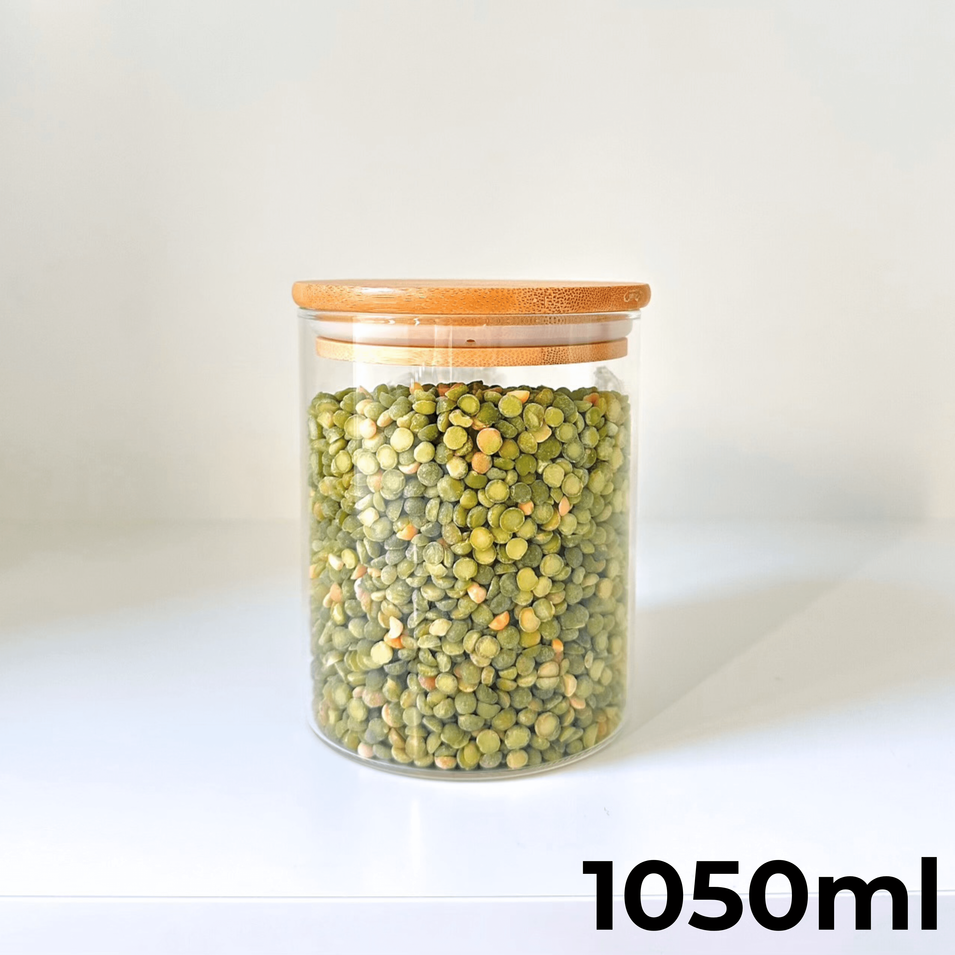 1050ml round clear glass storage jar with a natural airtight bamboo lid filled with dry ingredients — view 3