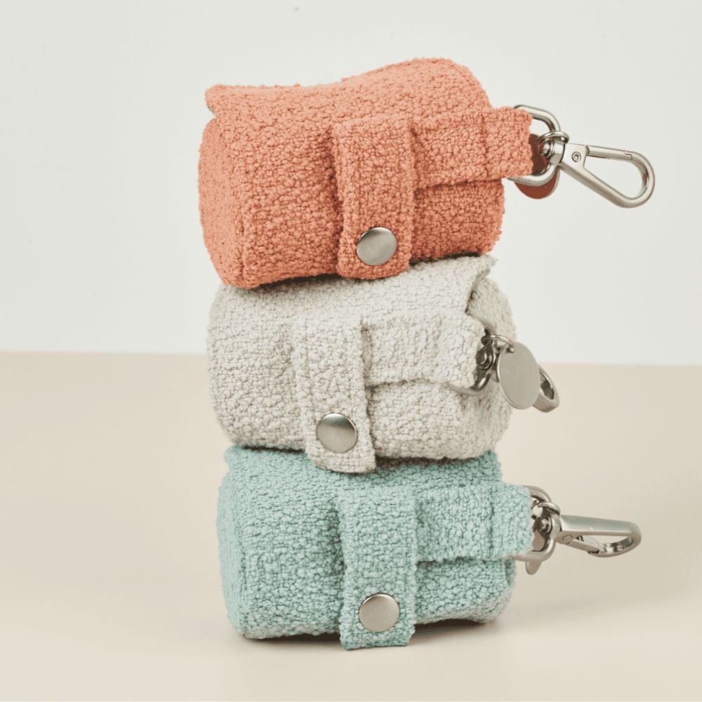 Cloud coloured boucle pet waste bag holder with two secure attachment straps for dog walking