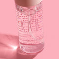 Hydrating setting mist spray bottle showcasing fine mist applicator and fresh coconut water formula