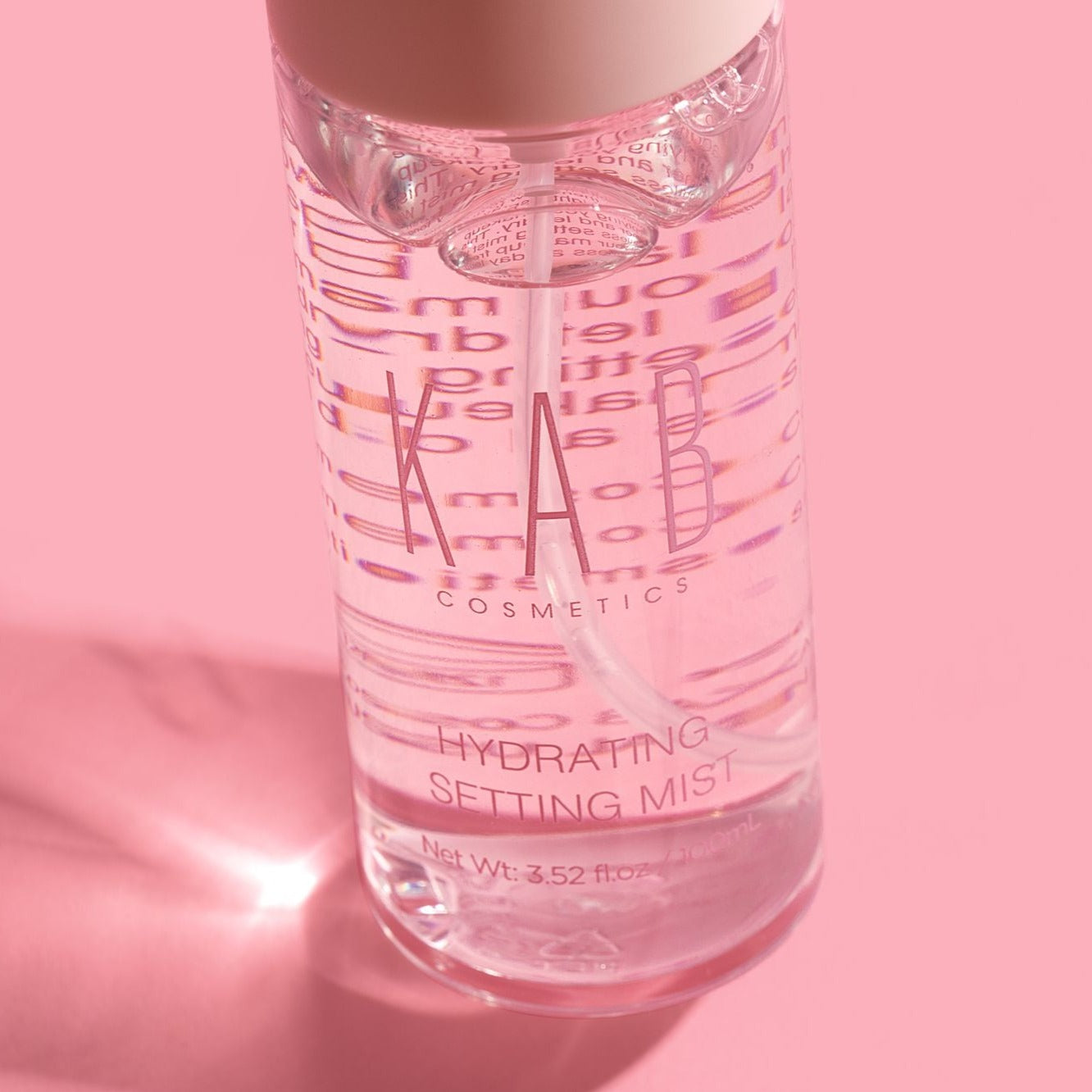 Hydrating setting mist spray bottle showcasing fine mist applicator and fresh coconut water formula