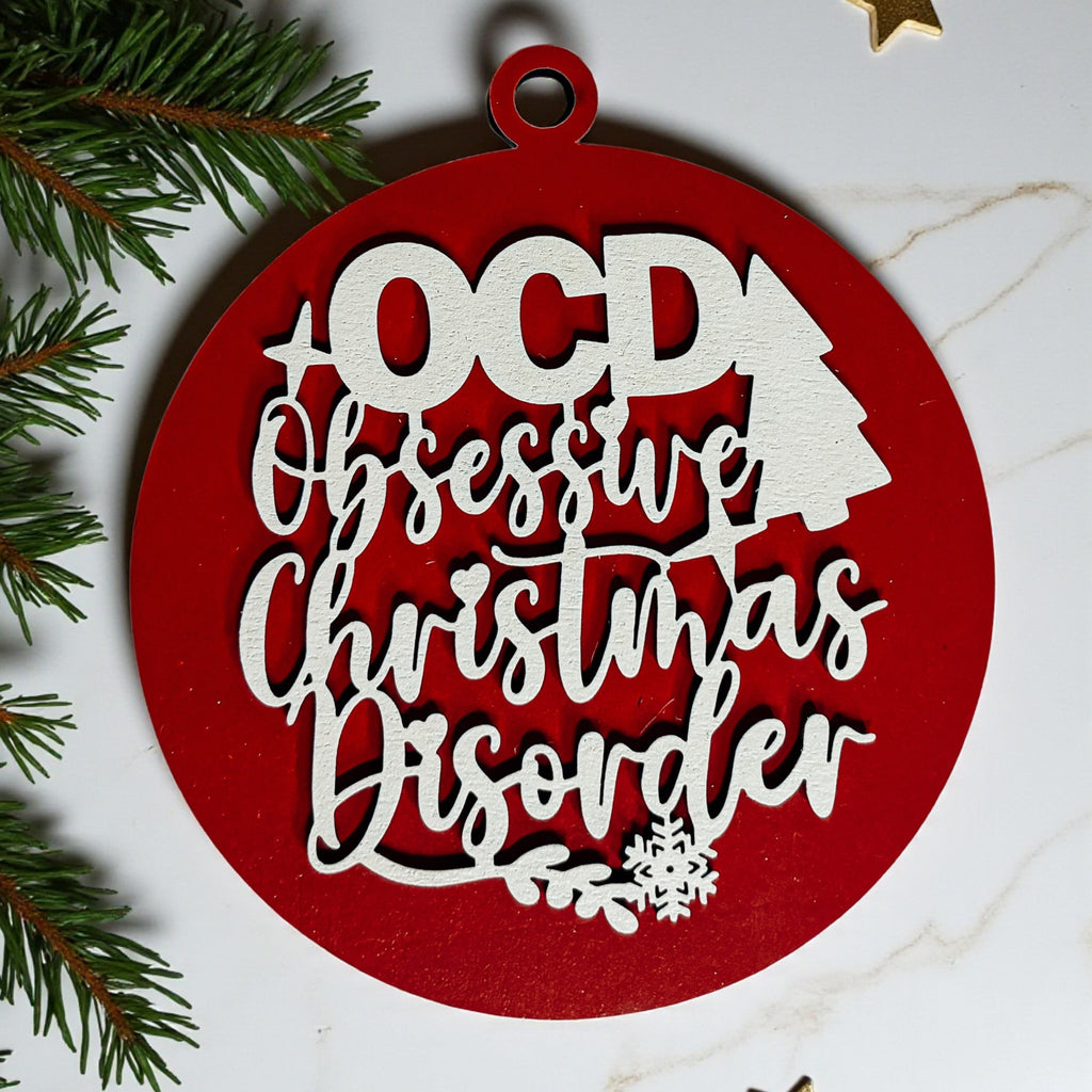 Obsessive Christmas Disorder round wooden ornament with a 3D tree and snowflakes