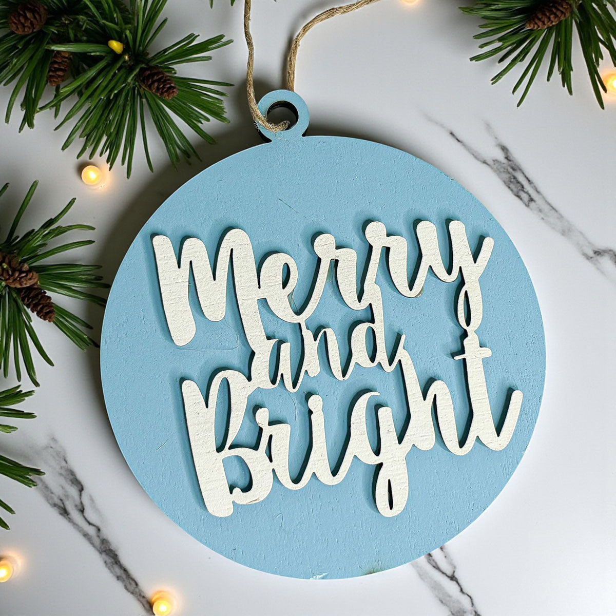 Merry and Bright wooden Christmas ornament with 3D lettering and rustic jute hanging string — view 2