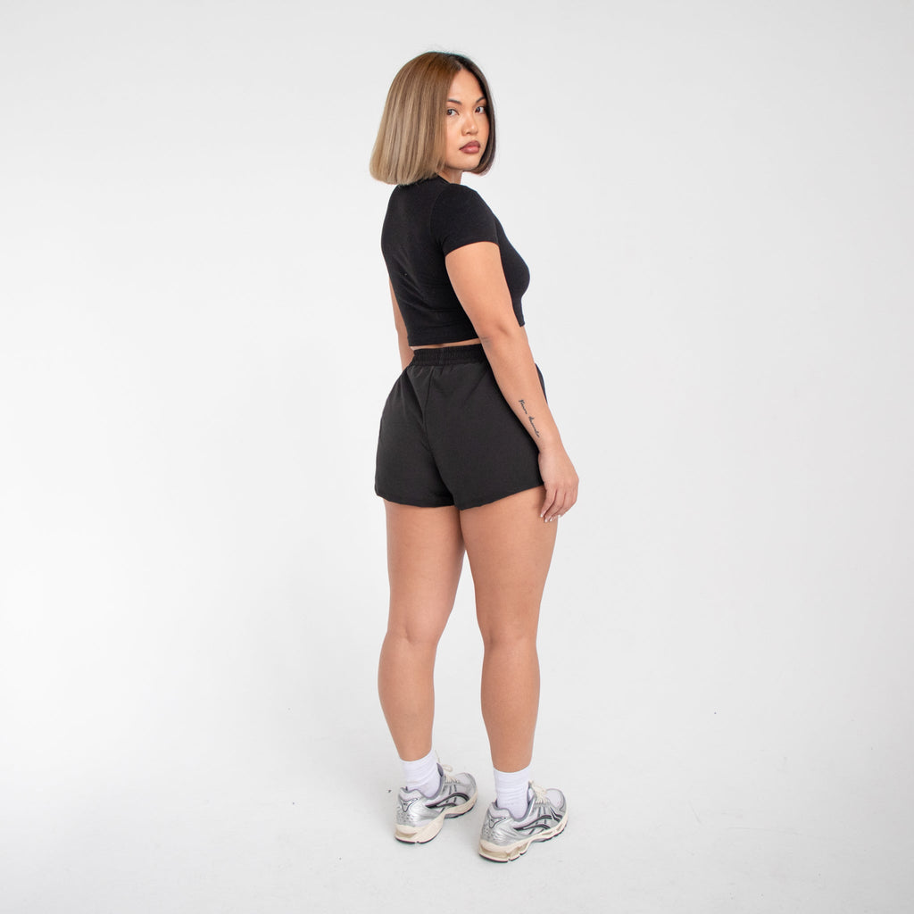 Women's athletic running shorts in lightweight breathable nylon featuring an elastic waistband — view 4