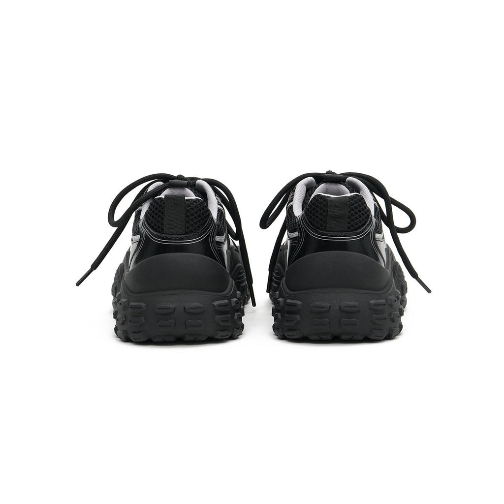 Women's chunky breathable running shoes with wavy midsole and technical mesh upper in black — view 4