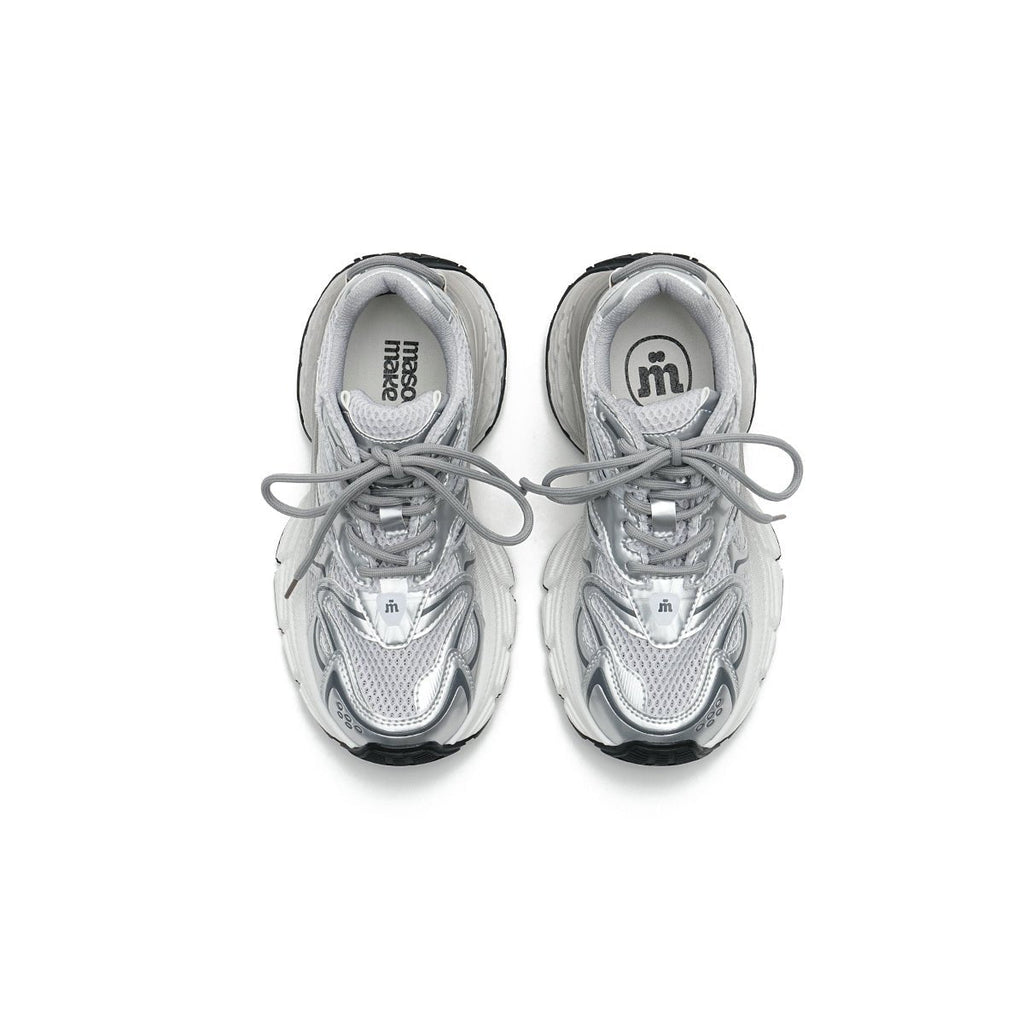 Women's chunky running shoes in metallic silver mesh with thick sculpted soles and curved lines — view 3