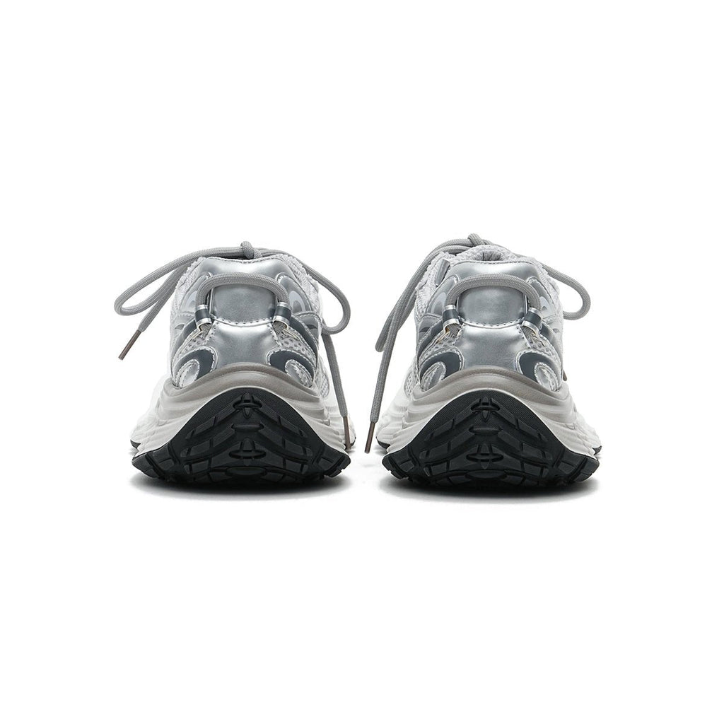 Women's chunky running shoes in metallic silver mesh with thick sculpted soles and curved lines — view 4