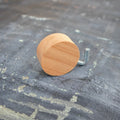 Minimalist round beechwood wall hook with adhesive backing for drill-free home organization