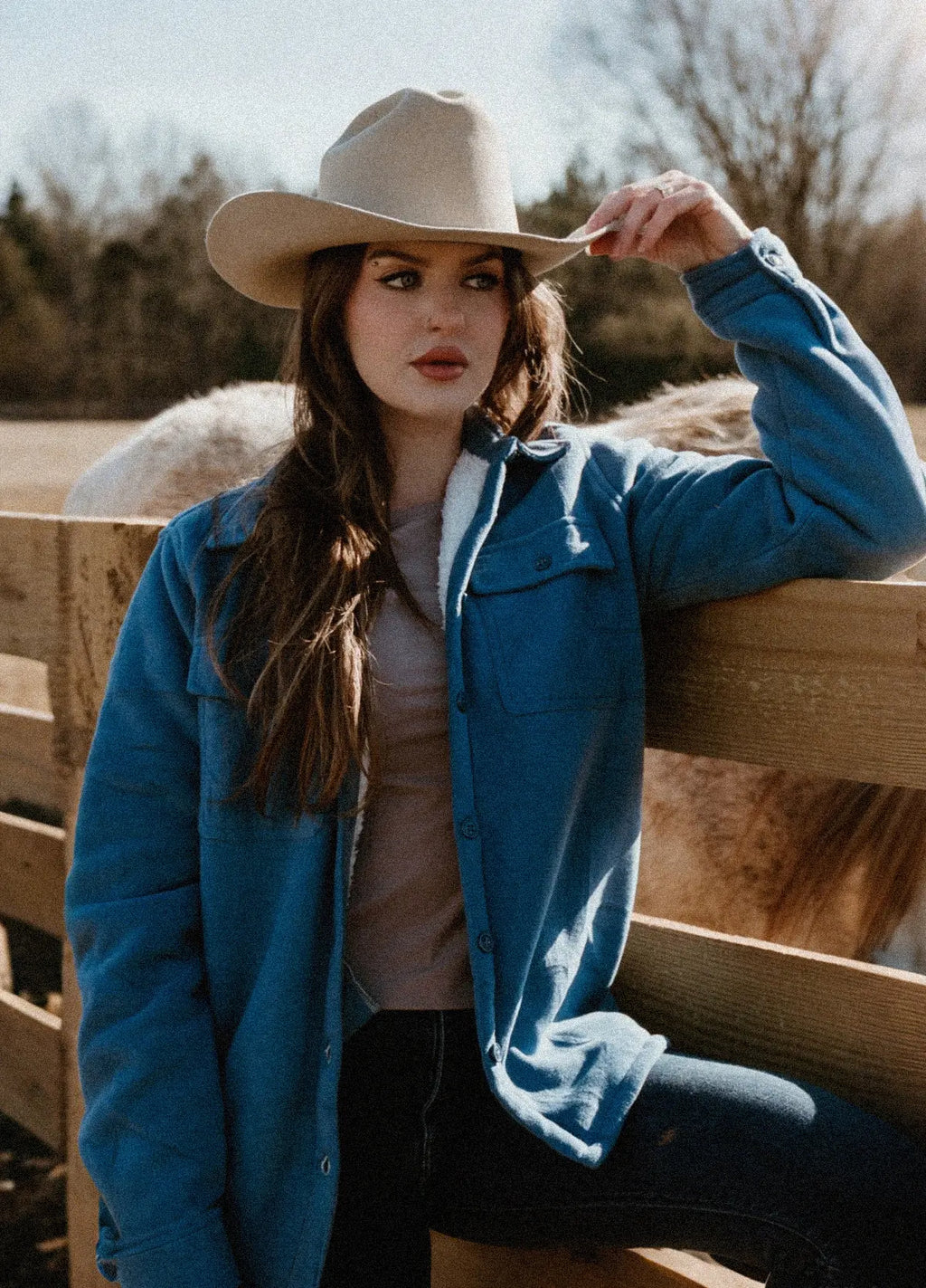 Womens sherpa lined winter fleece shirt jacket with button up front and twin chest pockets