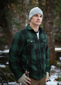 Mens Sherpa lined plaid flannel shacket with snap front closure and four functional pockets