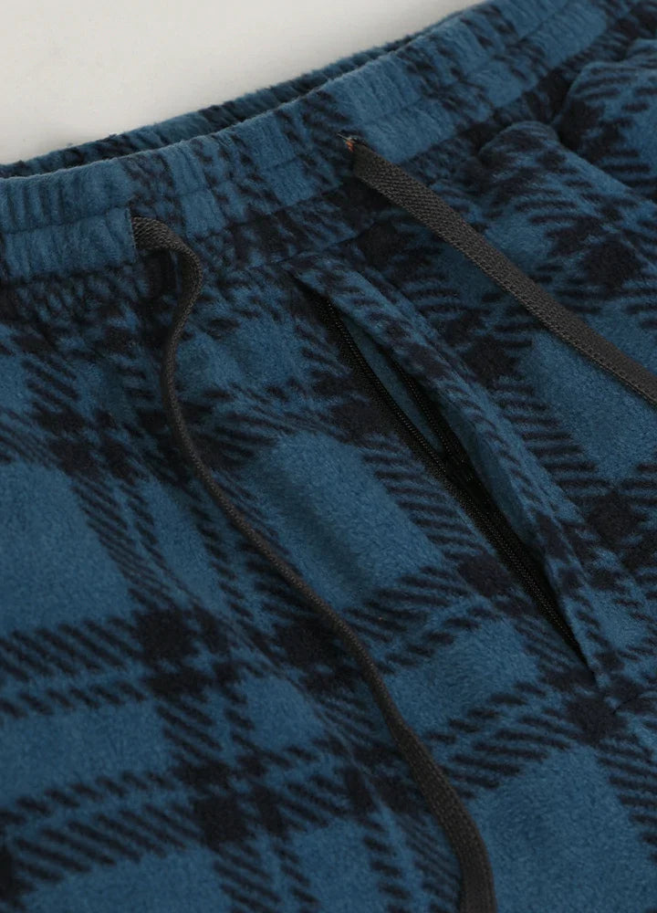 Men's plush fleece plaid pajama pants with an adjustable drawstring waist and practical front pockets — view 3
